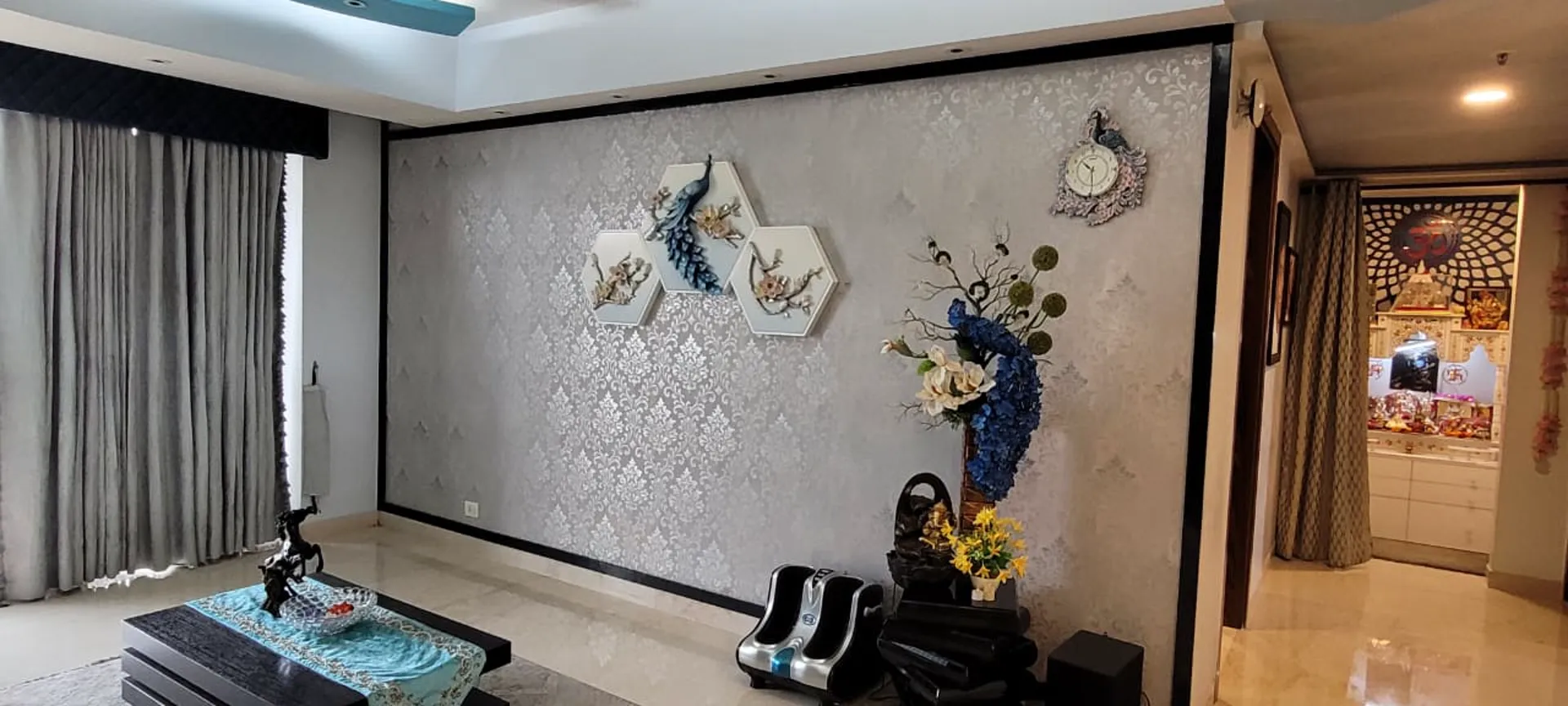 Premium living room interior with hand-crafted wall art and layered lighting, completed by Nimbus Interiors